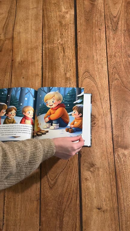 A child turning pages in a TinyTeller book