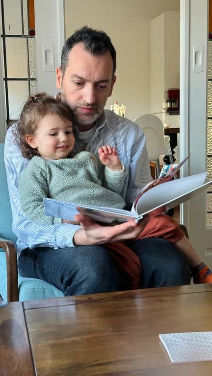 A printed personalized book open on a table